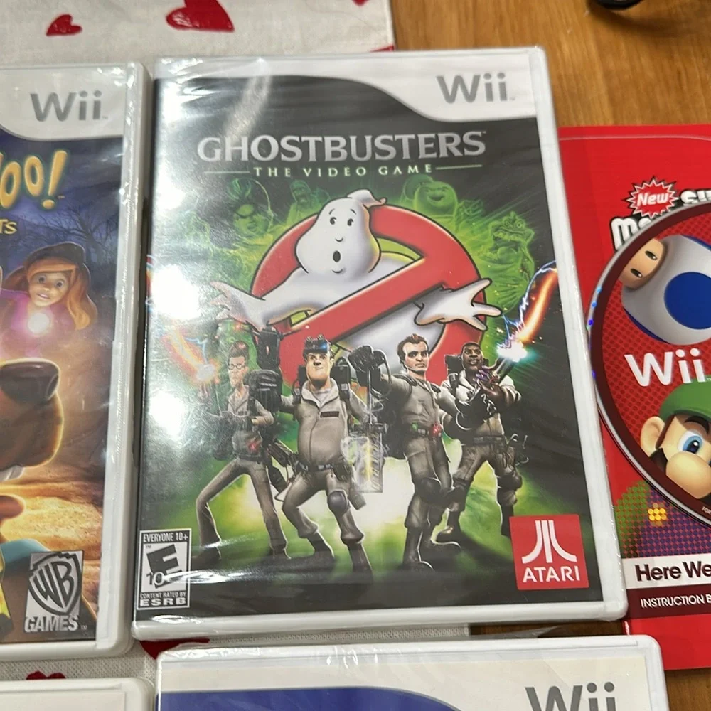Nintendo Wii black w 2 remotes and 7 games.6 games in cases 1 has no case.